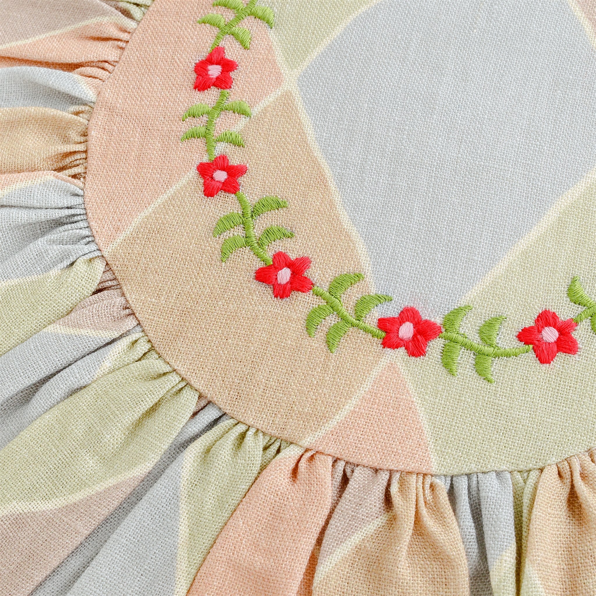 Harlequin round cushion, macaron