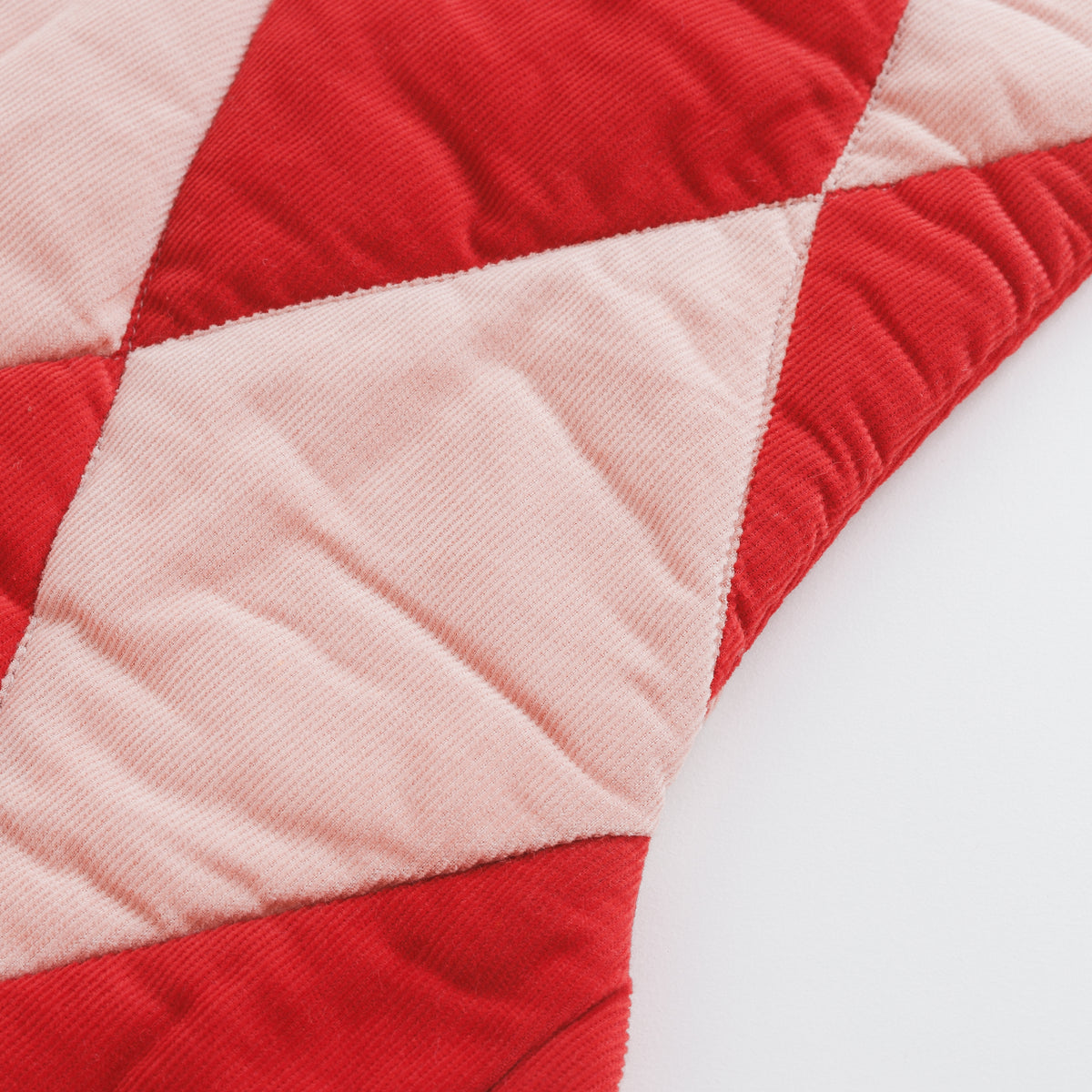 Harlequin patchwork Christmas stocking, red/pink