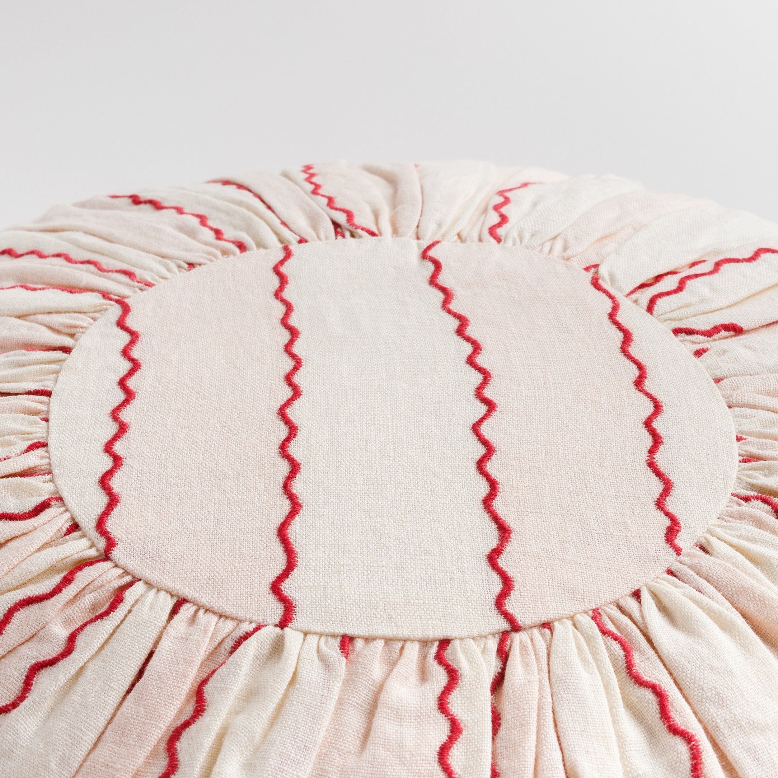 Marionette embroidered stripe round cushion, pink/cream
