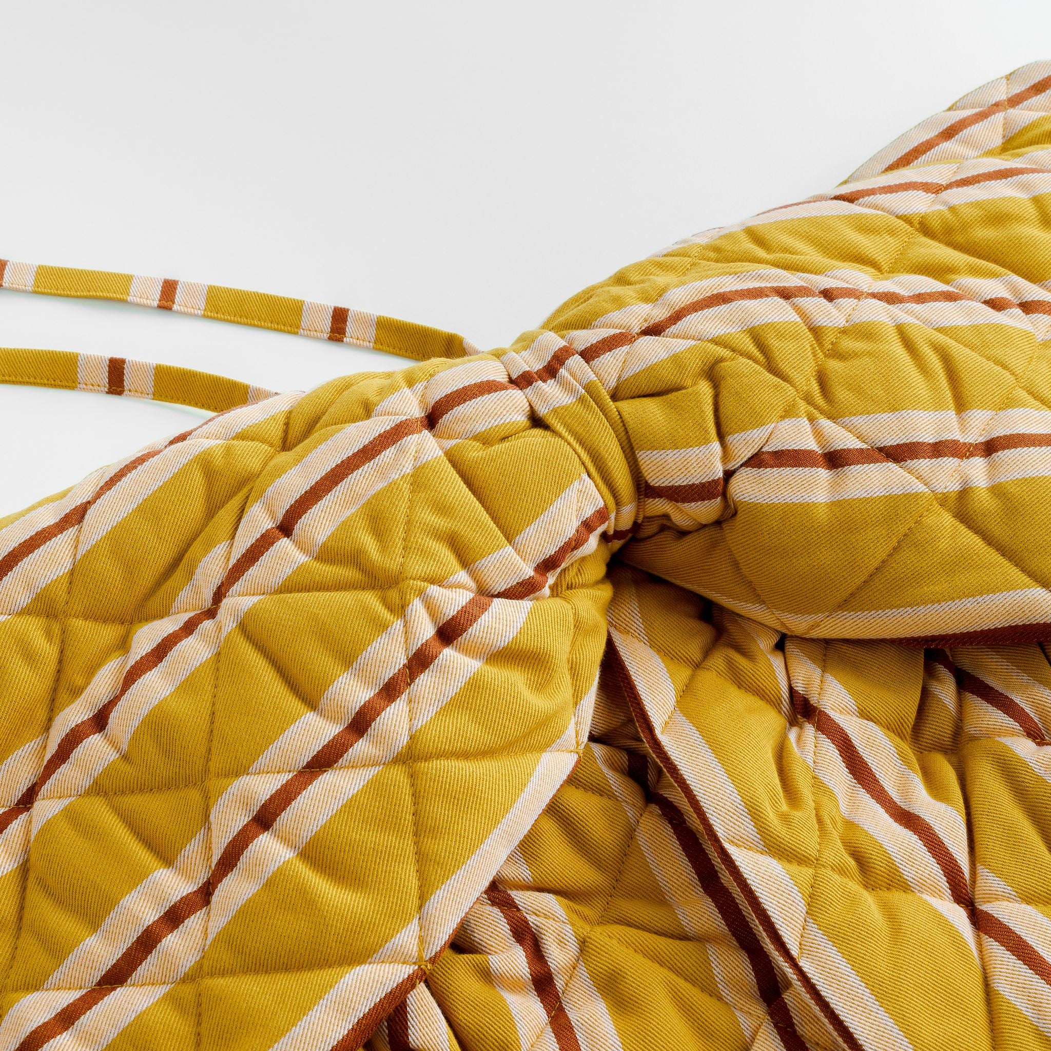 Turmeric pop stripe quilted bow