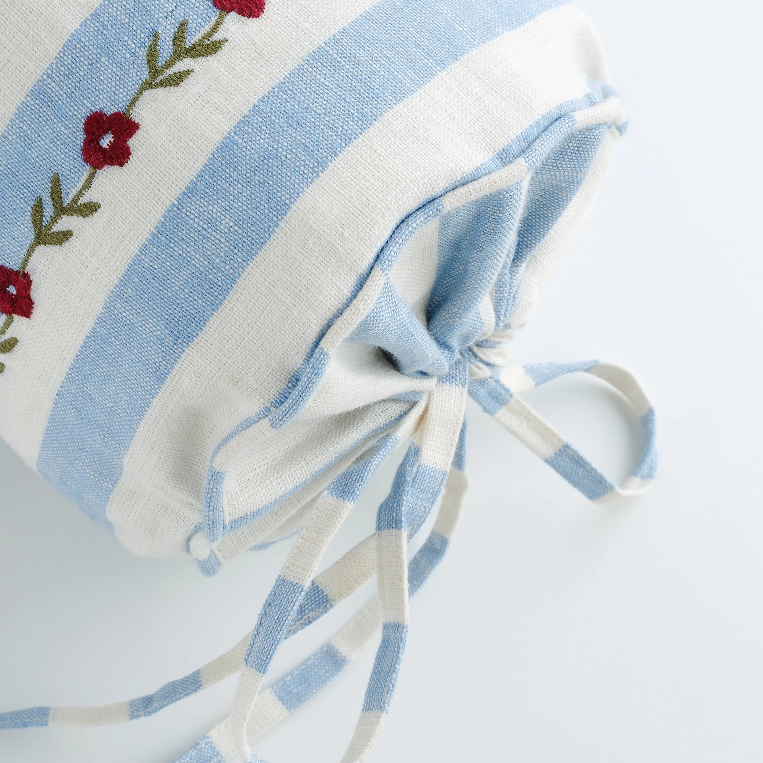 Candy striped embroidered bolster cushion, cornflower