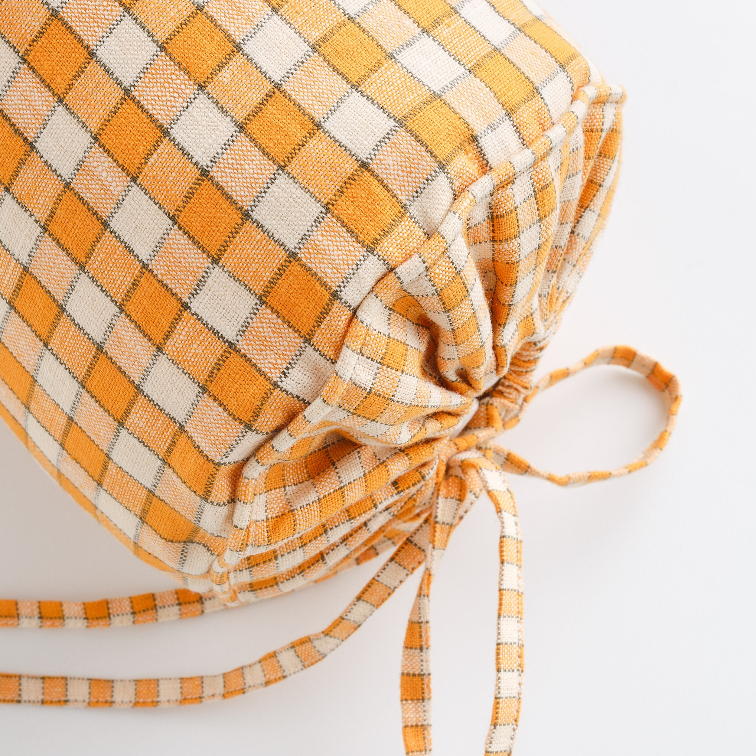 Gingham bolster cushion, apricot