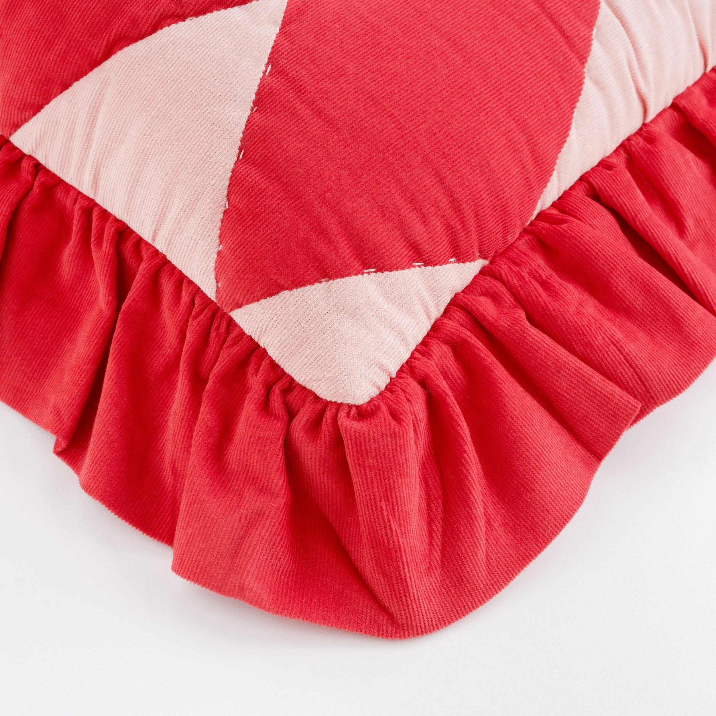 Harlequin cord cushion, red/pink