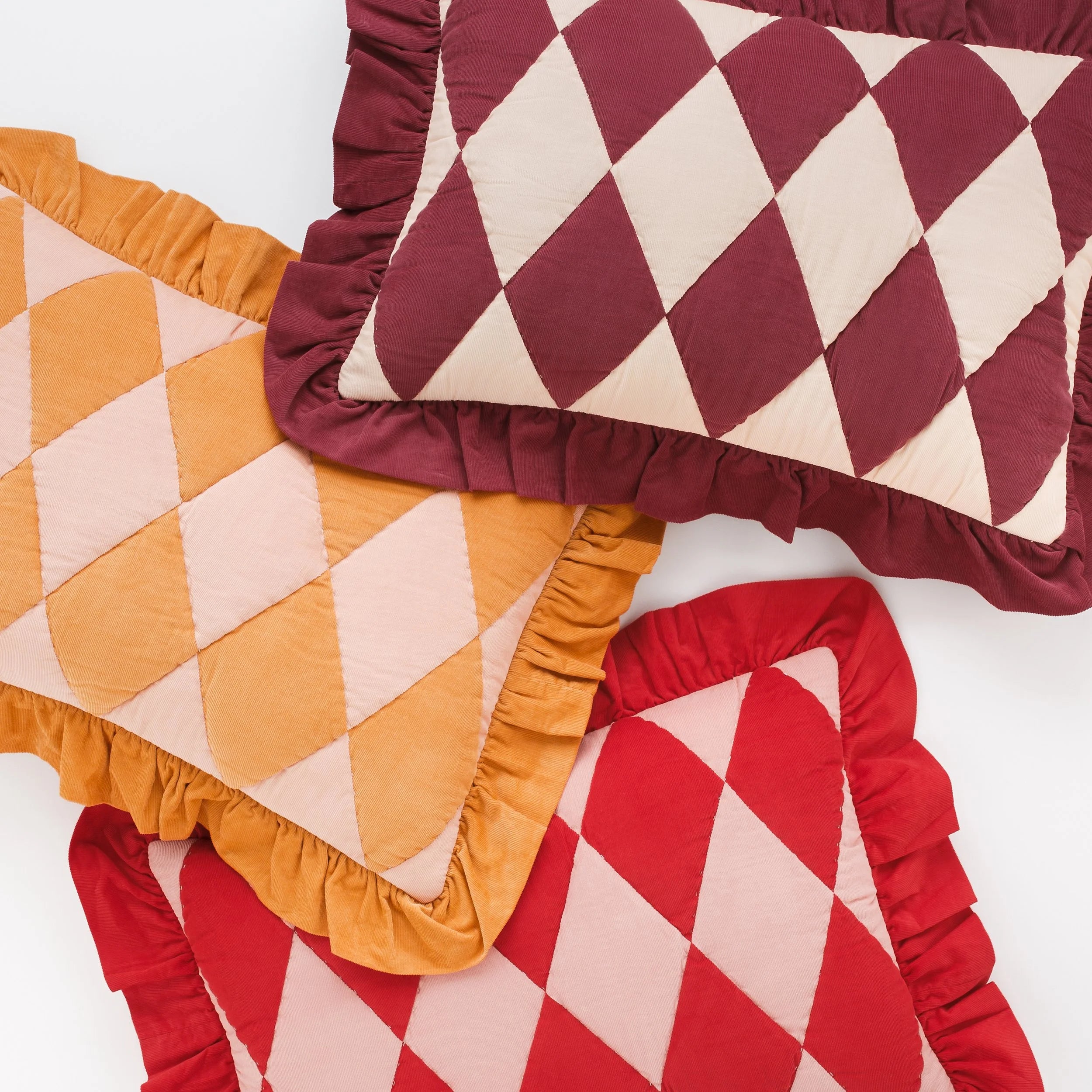 Harlequin cord cushion, red/pink