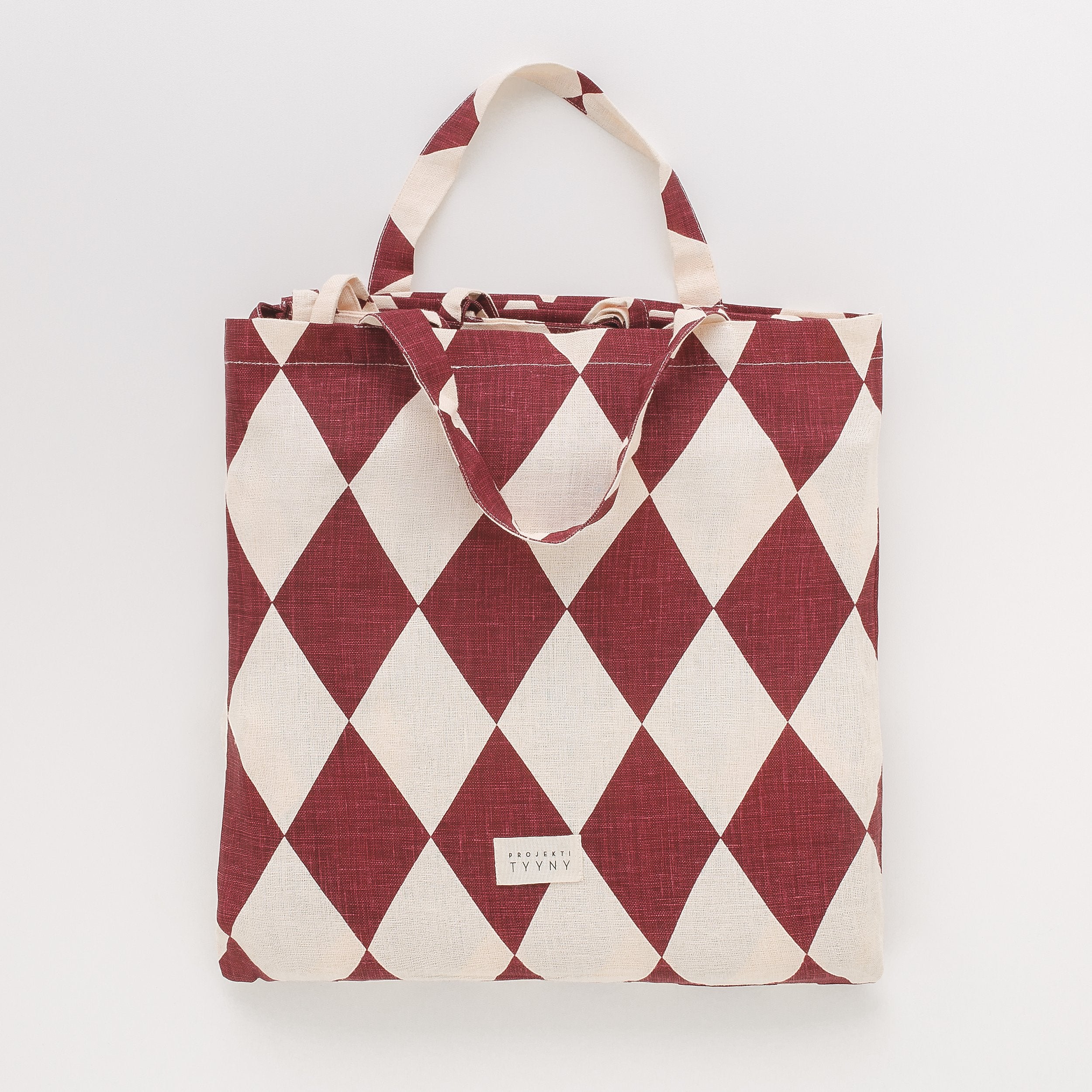 Harlequin linen curtains, a pair in a bag, claret/cream