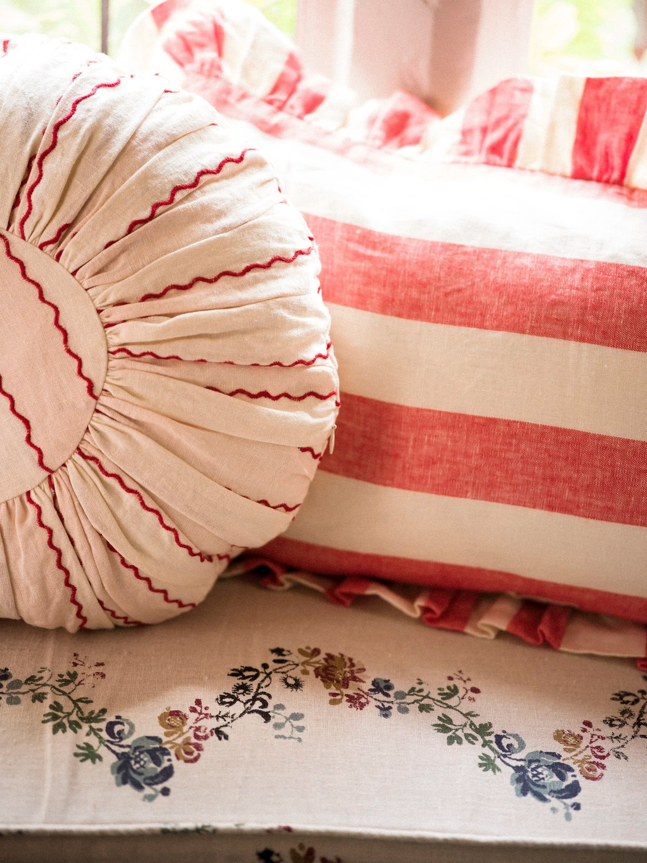 Marionette embroidered stripe round cushion, pink/cream