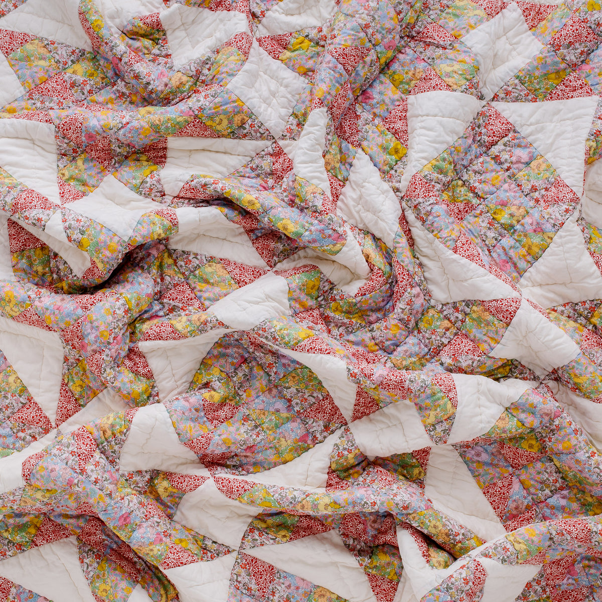 Patch of Paradise, made with Liberty fabrics, patchwork quilt, red