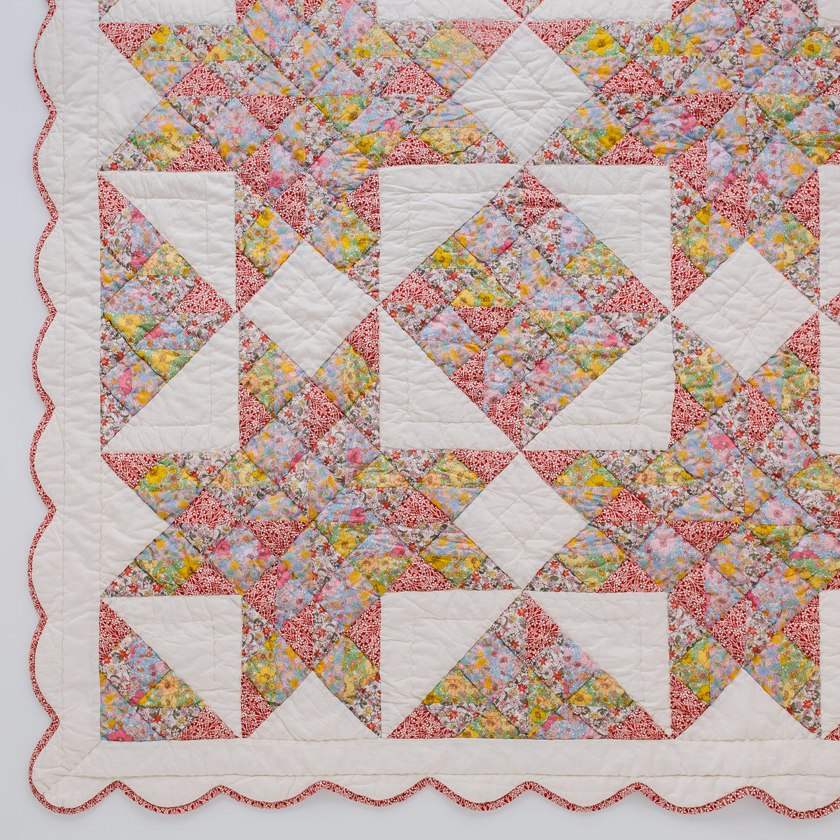 Patch of Paradise, made with Liberty fabrics, patchwork BABY quilt, red